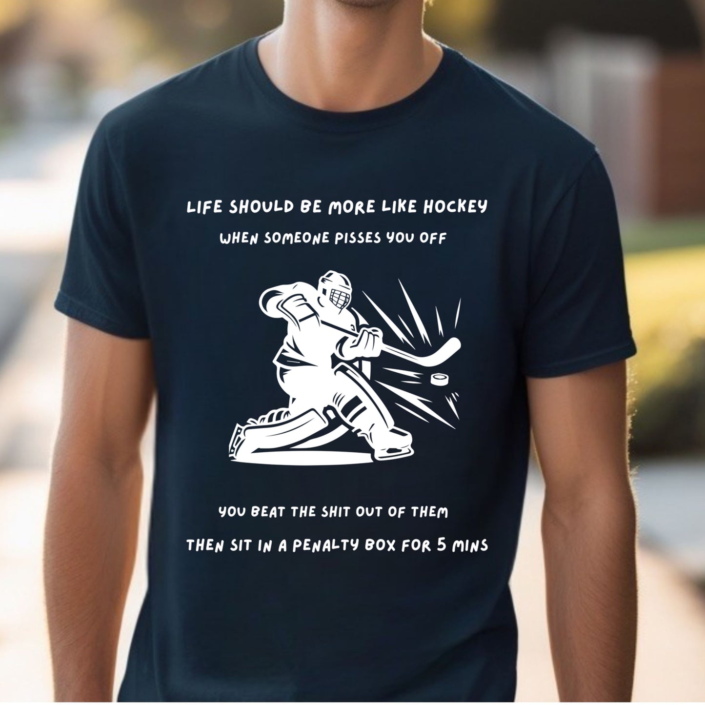Black t-shirt on male model with hockey graphic and humorous text worn by a person.