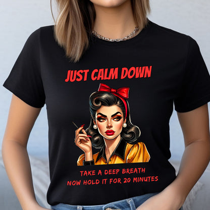 Black t-shirt with a graphic of a woman and text 'Just Calm Down, Take a Deep Breath Now Hold It for 20 Minutes' on a plain background.