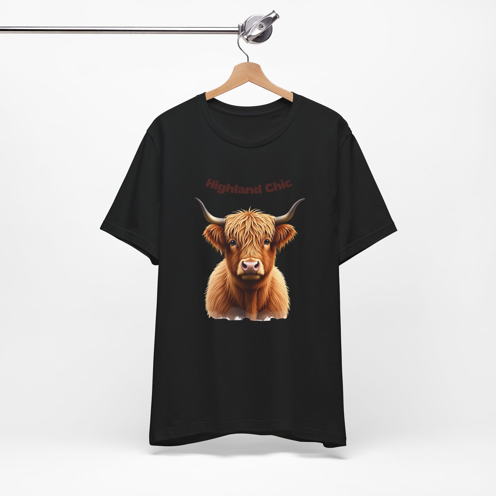 Highland Chic Highland Cow Black T-Shirt Design on hanger