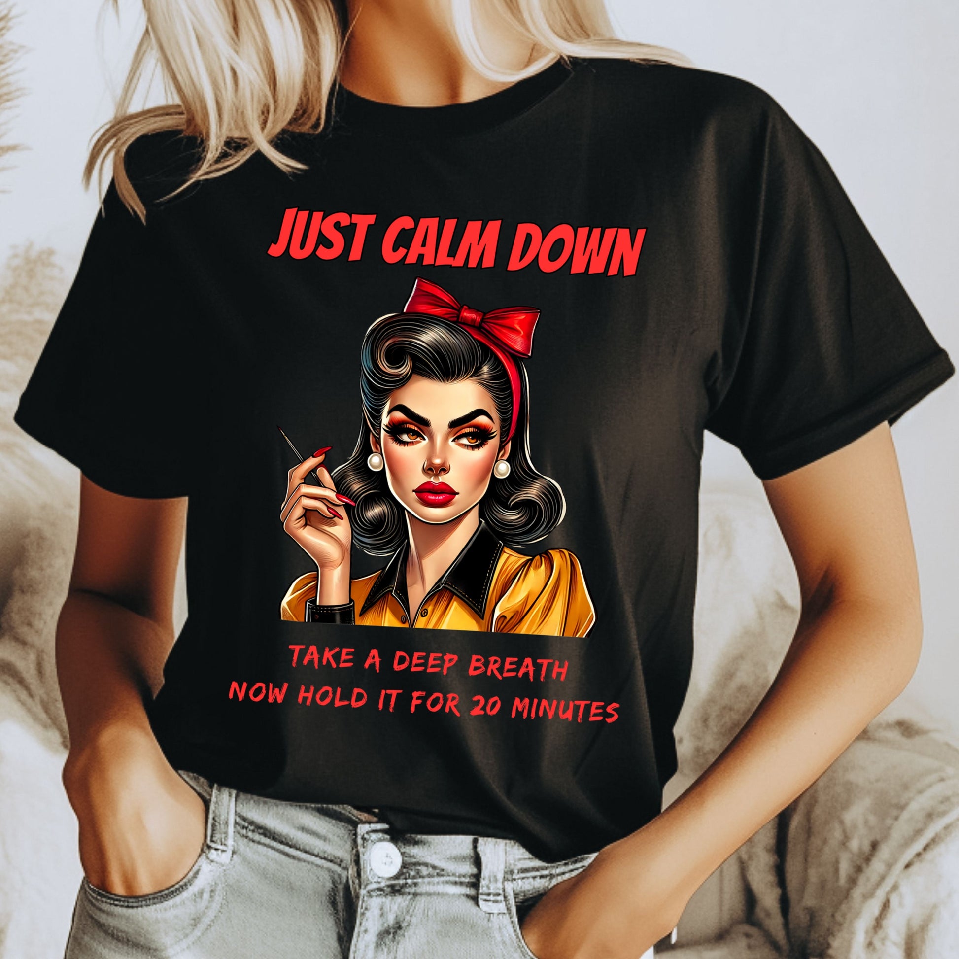 Person wearing a black t-shirt with a graphic design and text.