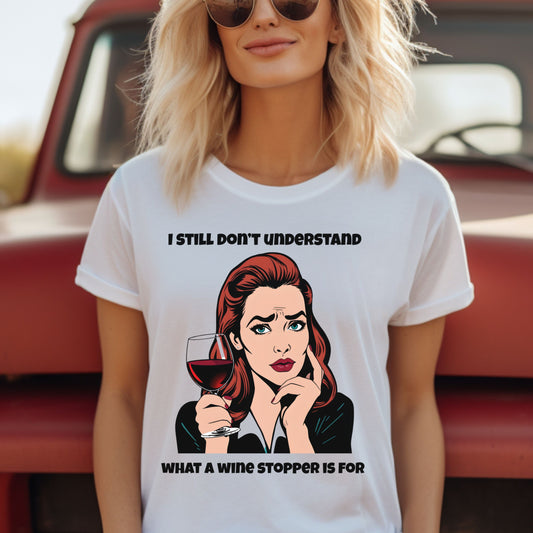 Woman wearing a white t-shirt with a graphic and text in front of a red vehicle.