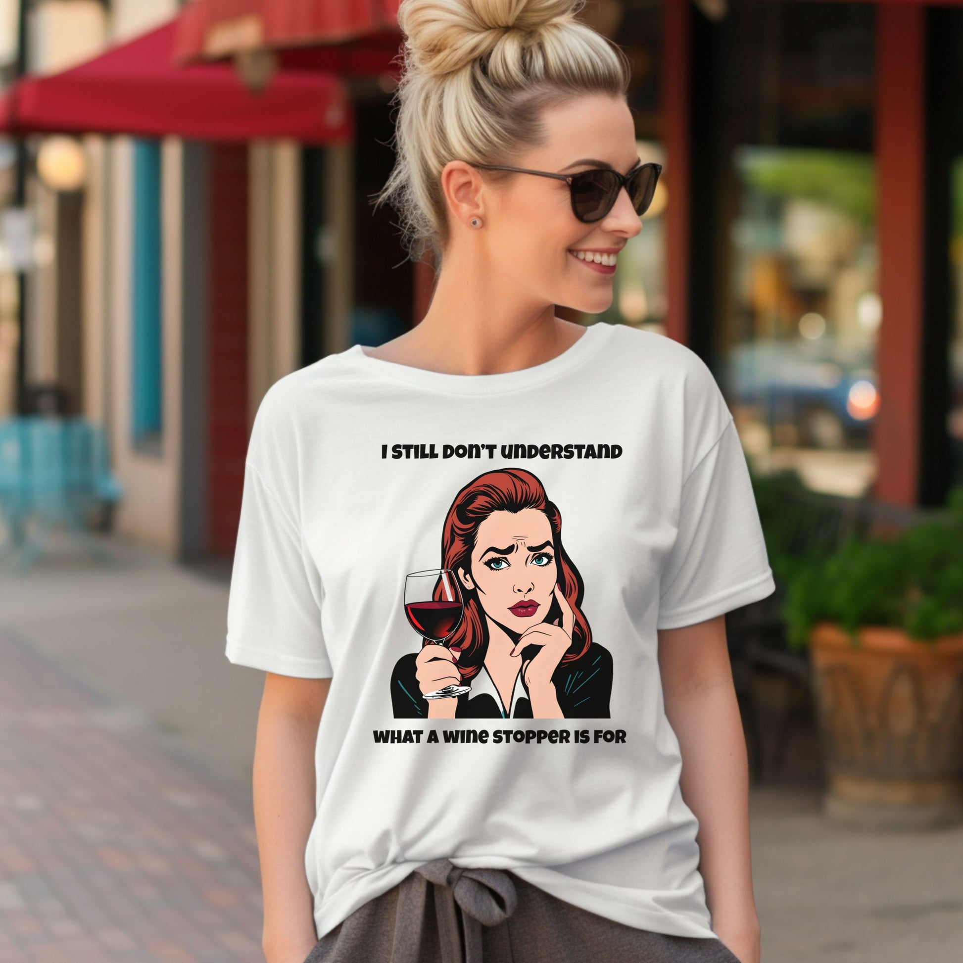 Woman wearing a white t-shirt with a graphic and text on a city street.